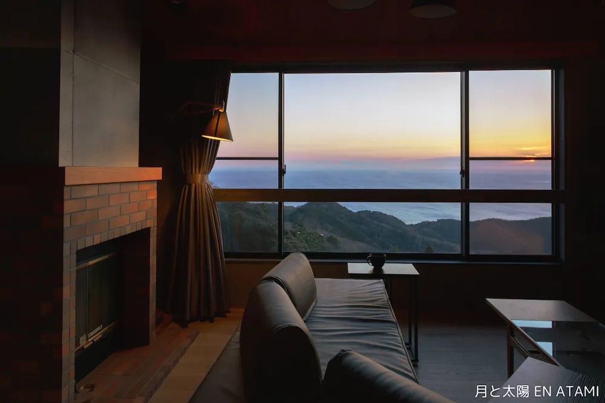 Our guest room's living area overlooks the sea. It's perfect for a relaxed stay with a small group.