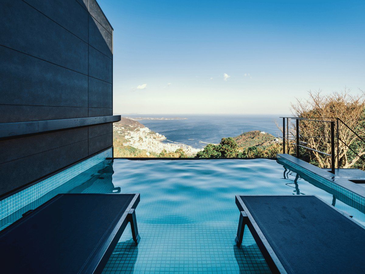 The infinity pool viewed from a different angle. The scenery beyond the water's surface is striking.
