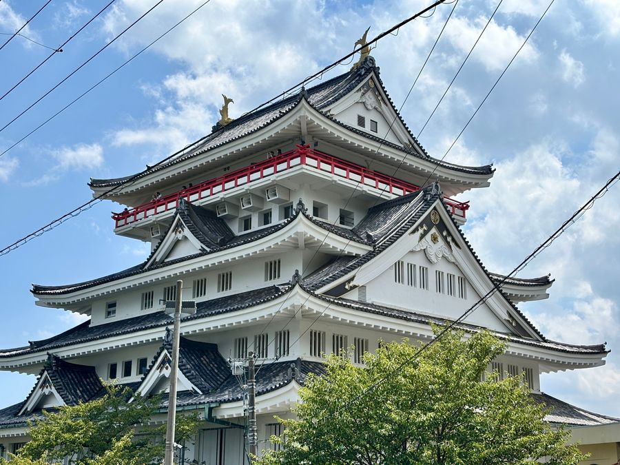 Atami Castle's exterior against a blue sky